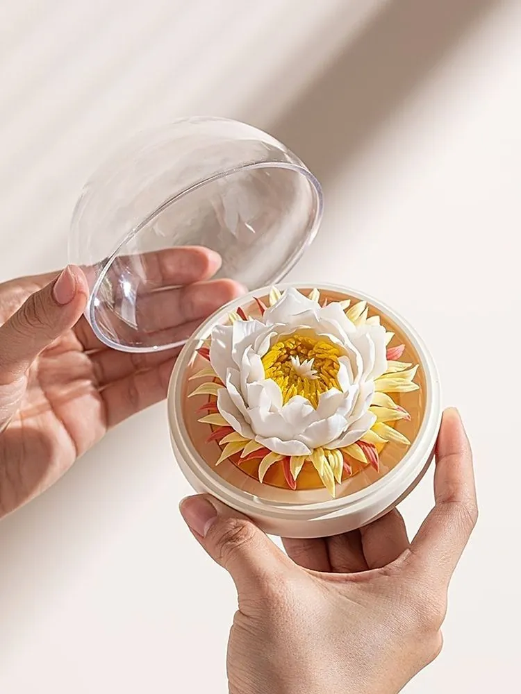 Lifting the clear dome off a small porcelain flower