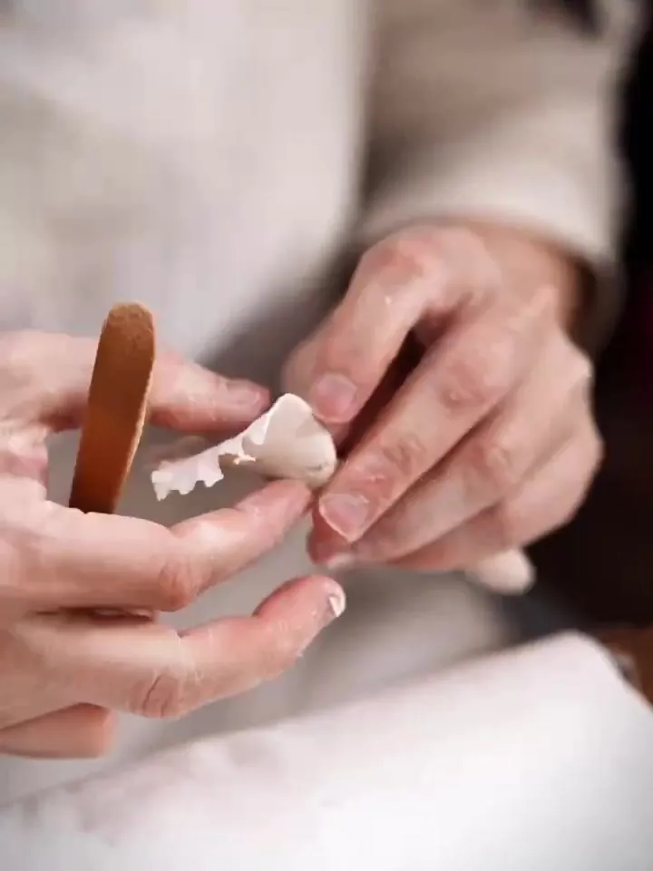 Clay: Each flower begins as a lump of fine porcelain clay from Dehua.